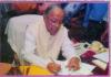 Jyoti Basu Signing the last file as the Chief minister