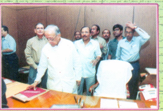 Jyoti Basu glances through the files